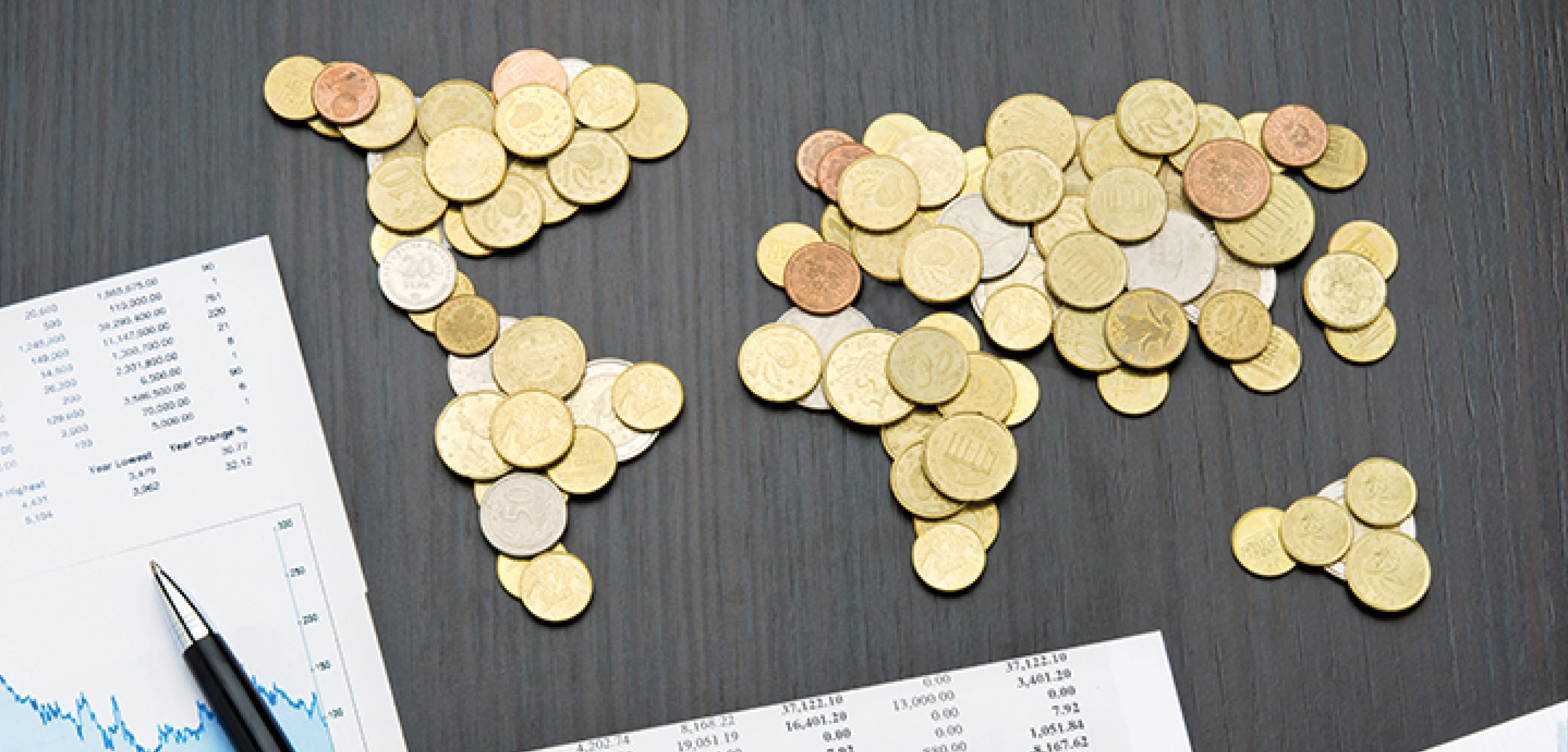 Coins arranged as a world map, representing financial capability